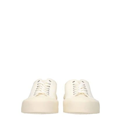 Jil Sander Beige Fabric Low Top Sneakers with lace-up closure, sporty glam style, and rubber sole, featuring a mid heel and round toe.
