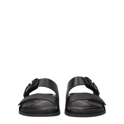 Valentino Garavani Black Leather Slippers with front logo, casual style, open toe, low flat heel, leather with rubber sole.