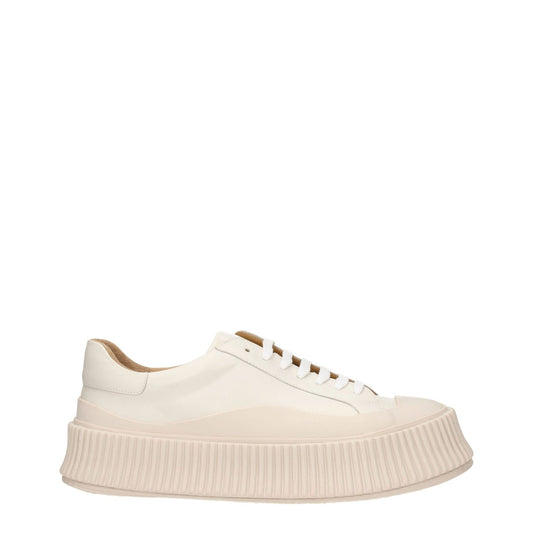 Jil Sander Beige Leather Platform Sneakers with wedge heel and lace-up closure, featuring a stylish aged effect and rubber sole.