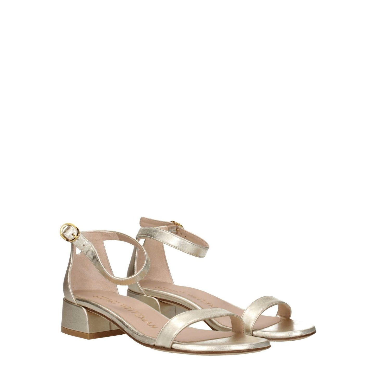 Stuart Weitzman Gold Leather Flat Sandals with open toe, mid heels, and buckle closure, crafted from metallic platinum leather.