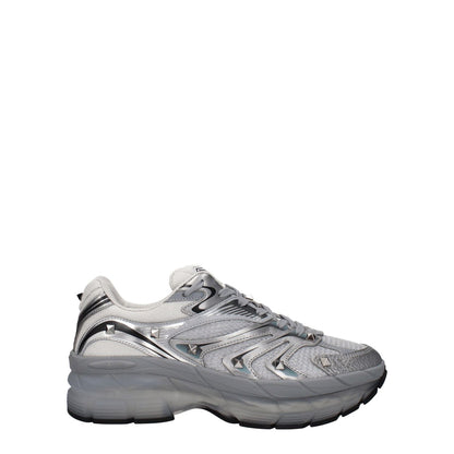 Valentino Garavani Gray Fabric Athletic Sneakers with studs and lace-up closure, featuring silver fabric, rubber sole, and round toe design.