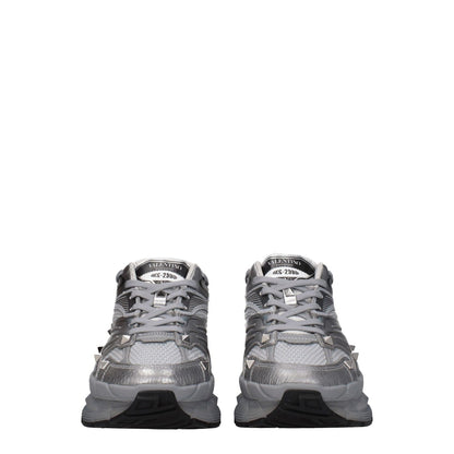 Valentino Garavani Gray Fabric Athletic Sneakers with studs and front logo, lace-up closure, rubber sole, and round toe design.