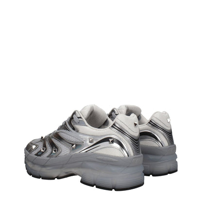 Valentino Garavani Gray Fabric Athletic Sneakers with studs and lace-up closure, featuring round toe and mid heels in silver fabric.