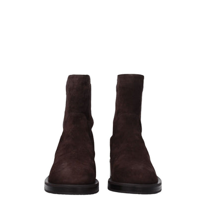 Stuart Weitzman Brown Leather Ankle Boots with mid heels and rubber sole, displaying a round toe design, made of suede material in hickory brown.