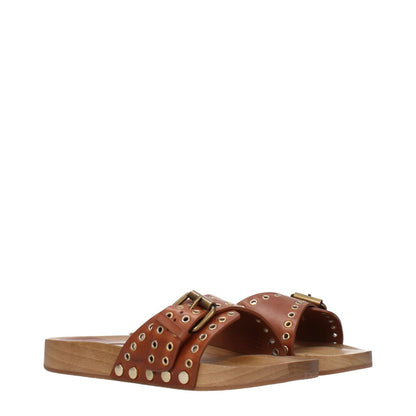 Isabel Marant Brown Leather Slippers with buckle closure and open toe, featuring a stylish design and rubber sole.