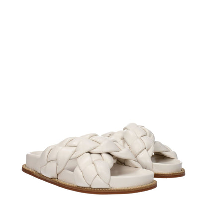 Fabiana Filippi Beige Leather Slippers with open toe, ivory accents, low flat heel, and rubber sole. Casual style for everyday wear.