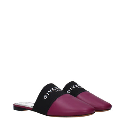 Givenchy Purple Leather Slippers with front logo, casual style, round toe, low flat heel, and leather sole in dark orchid color.