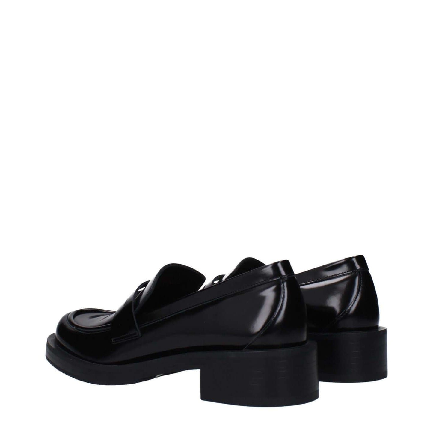 Stuart Weitzman Black Leather Slip-On Loafers with mid heels and round toe, back view showcasing glossy leather finish and rubber sole