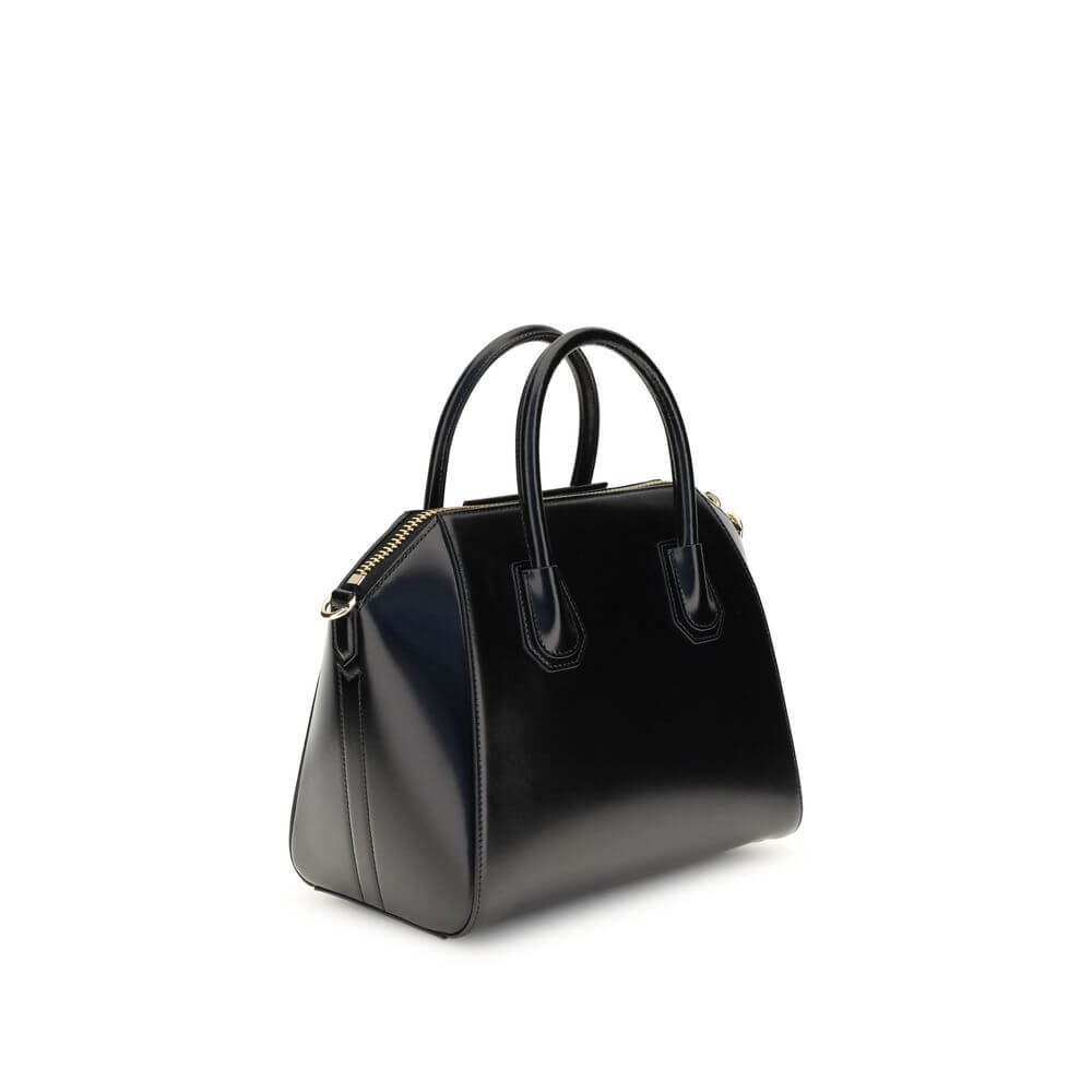 Givenchy Black Calf Leather Bos Taurus Handbag with gold accents and adjustable shoulder strap.