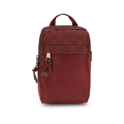 Gucci Bordeaux Polyamide Shoulder Bag with GG nylon, green-red web, mesh detail, and zippered pocket, front view.