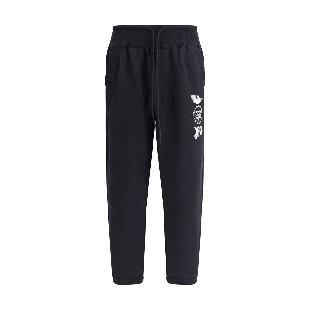 Y-3 Black Cotton Joggers (Workout Pants) featuring elastic cuffs and logo detailing, made from 100% cotton for casual and sporty wear.