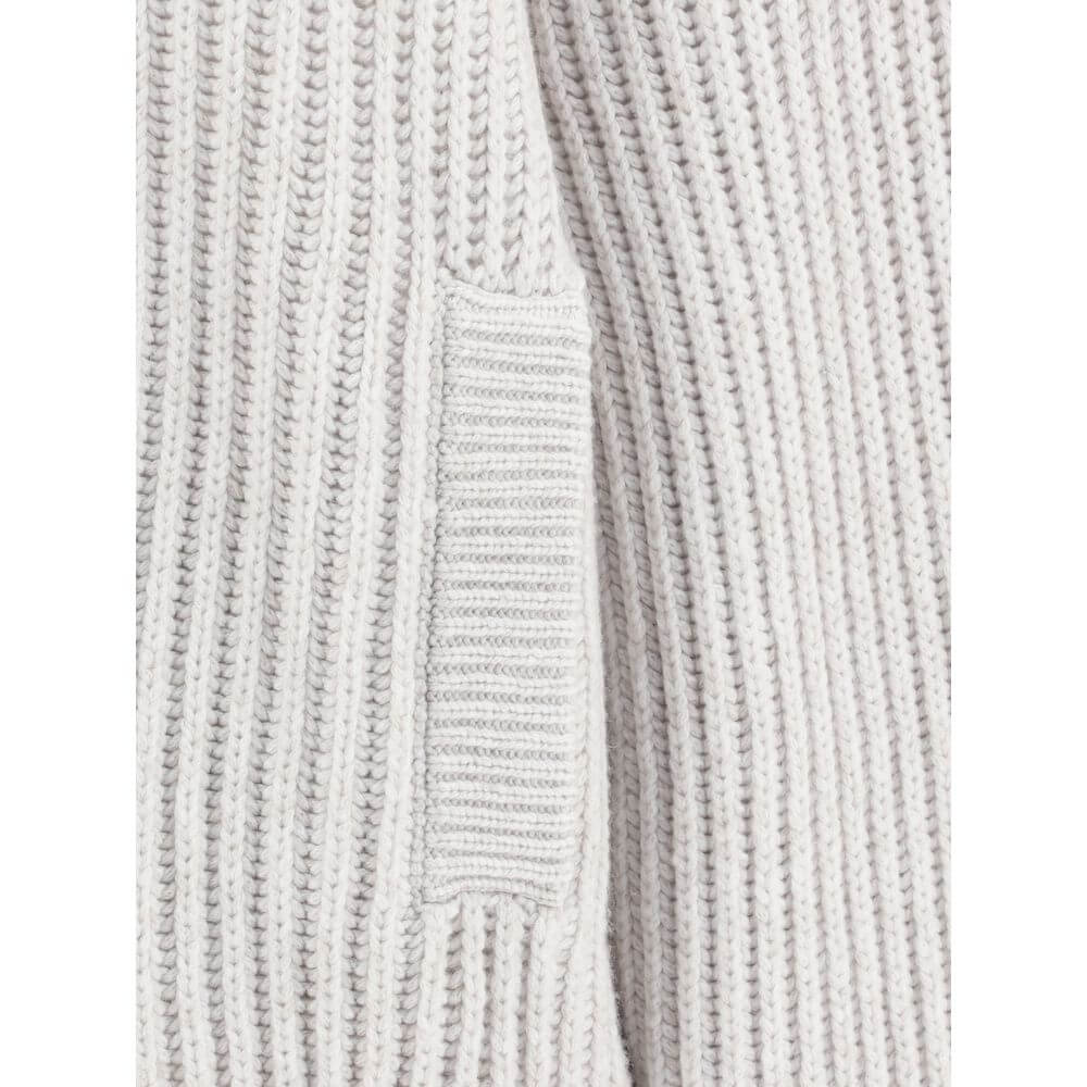 Close-up of the Brunello Cucinelli White Cashmere Cardigan showcasing ribbed texture and welt pocket detail.