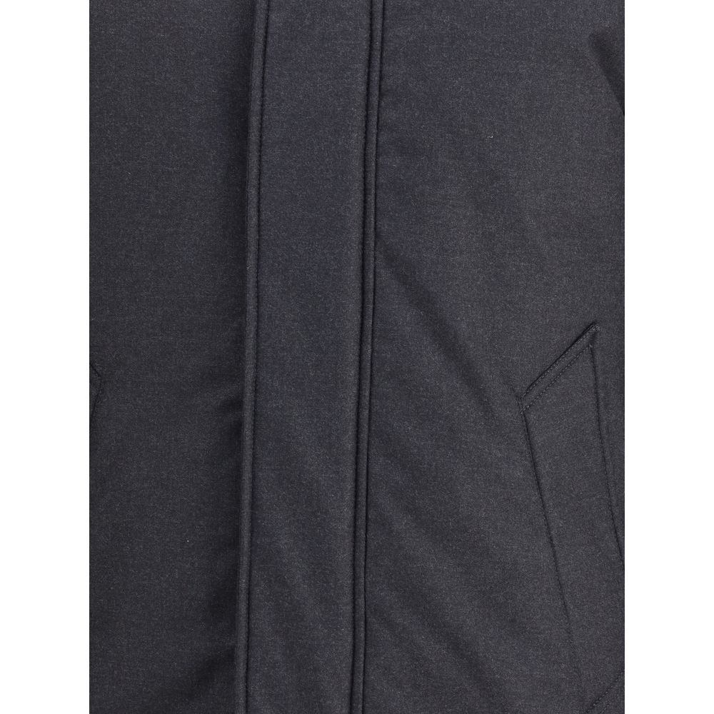 Close-up of Woolrich Black Fleece Wool Parka showing side welt pocket detail and flap closure.