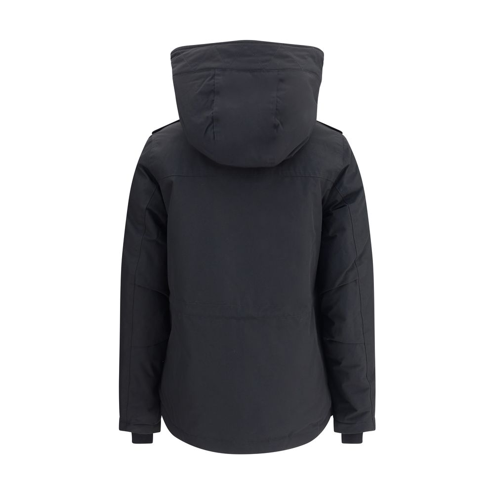Back view of Woolrich Black Cotton Shell Jacket with hood, showcasing padded design perfect for cold weather and practical front closure features.