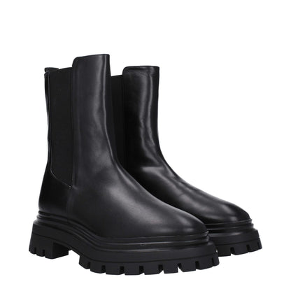 Stuart Weitzman Black Leather Ankle Boots with round toe and mid heels, rubber sole, ideal for casual style.