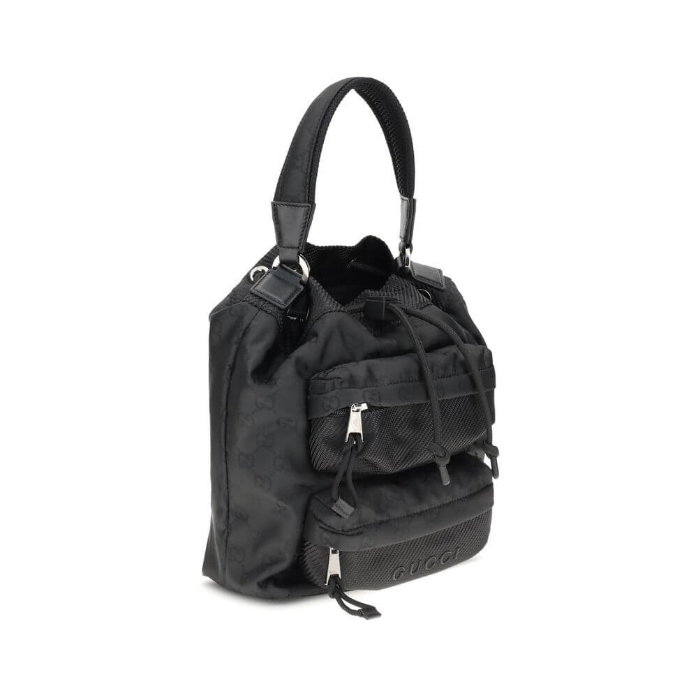 Gucci Black Polyamide Backet Bag with drawstring closure and GG Supreme pattern, featuring front zippered pockets and sturdy handle.