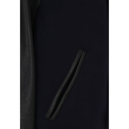 Close-up of side slit pocket on Golden Goose Blue Wool Bomber, featuring ribbed detailing and leather accents.