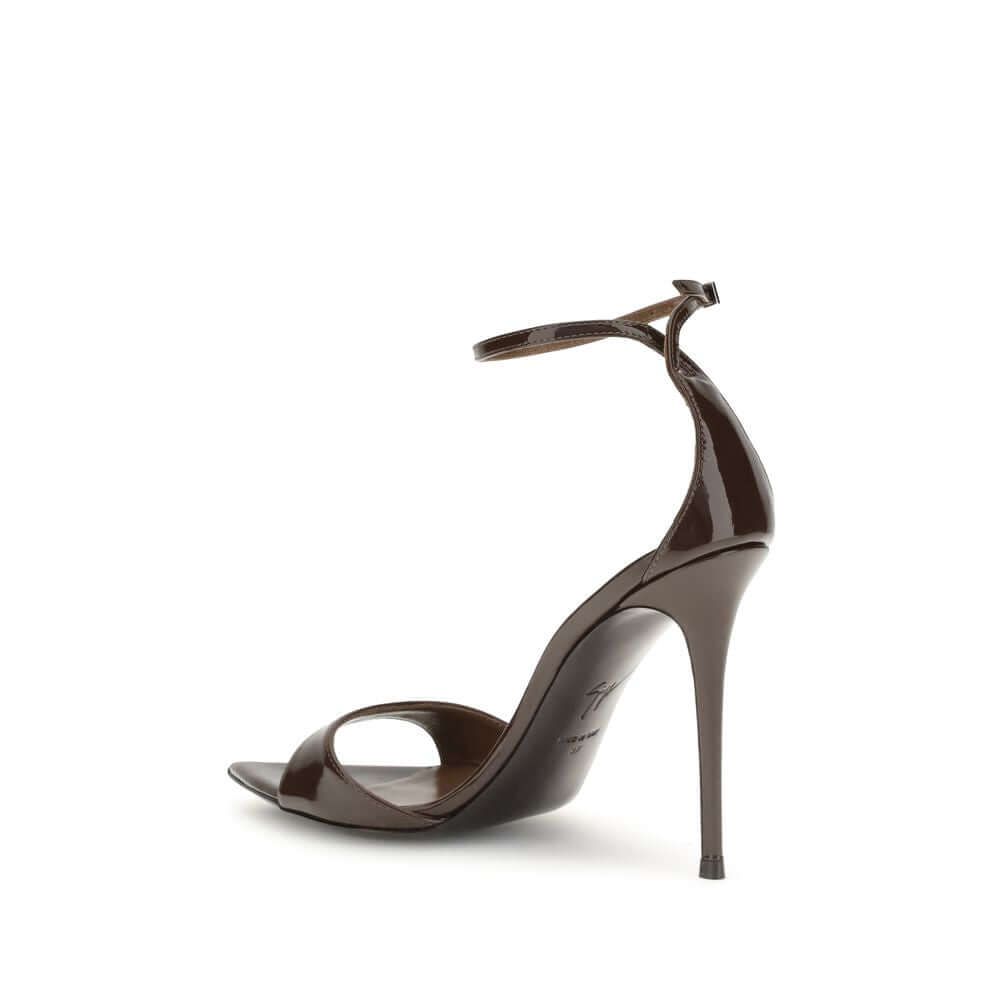 Giuseppe Zanotti Black Leather Stiletto Heel Sandals with patent finish and silver-tone strap.