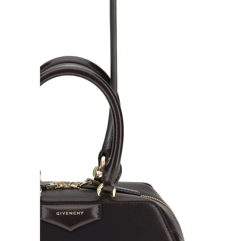 Close-up of Givenchy Brown Calf Leather Bos Taurus Handbag with gold finishes and zipper.