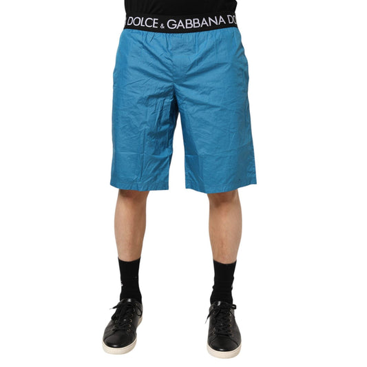 Dolce & Gabbana Blue Logo Waistband Beachwear Shorts Swimwear with black waistband featuring brand logo, stylish summer attire.