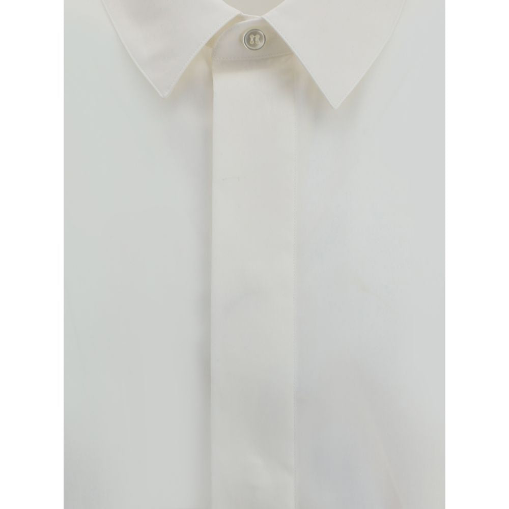 Close-up of Saint Laurent White Cotton Dress Shirt with classic collar and concealed buttons, featuring elegant and sophisticated design.