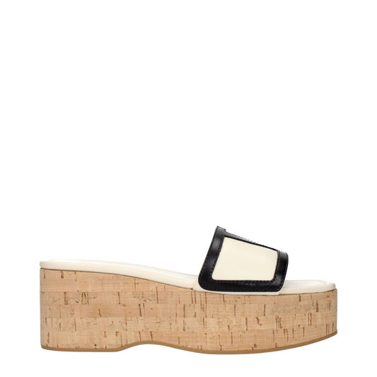 Valentino Garavani Beige Leather Wedge Sandals with cork sole and black trim, featuring a front logo design, side view.