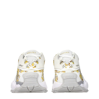 Versace Gold Fabric Low Top Sneakers with logo detailing on front, side, and back, featuring a unique gold print design.