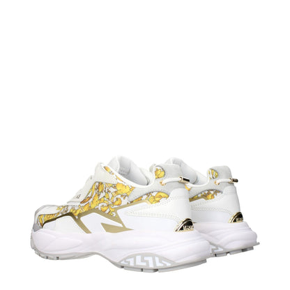 Versace Gold Fabric Low Top Sneakers with gold print, logos on front, side, and back, MPN 10163181A146866WG4V, code F84197.