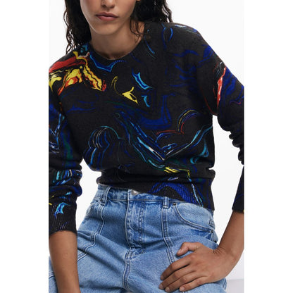 Woman wearing Desigual Black Polyamide Women Sweater with colorful abstract patterns.