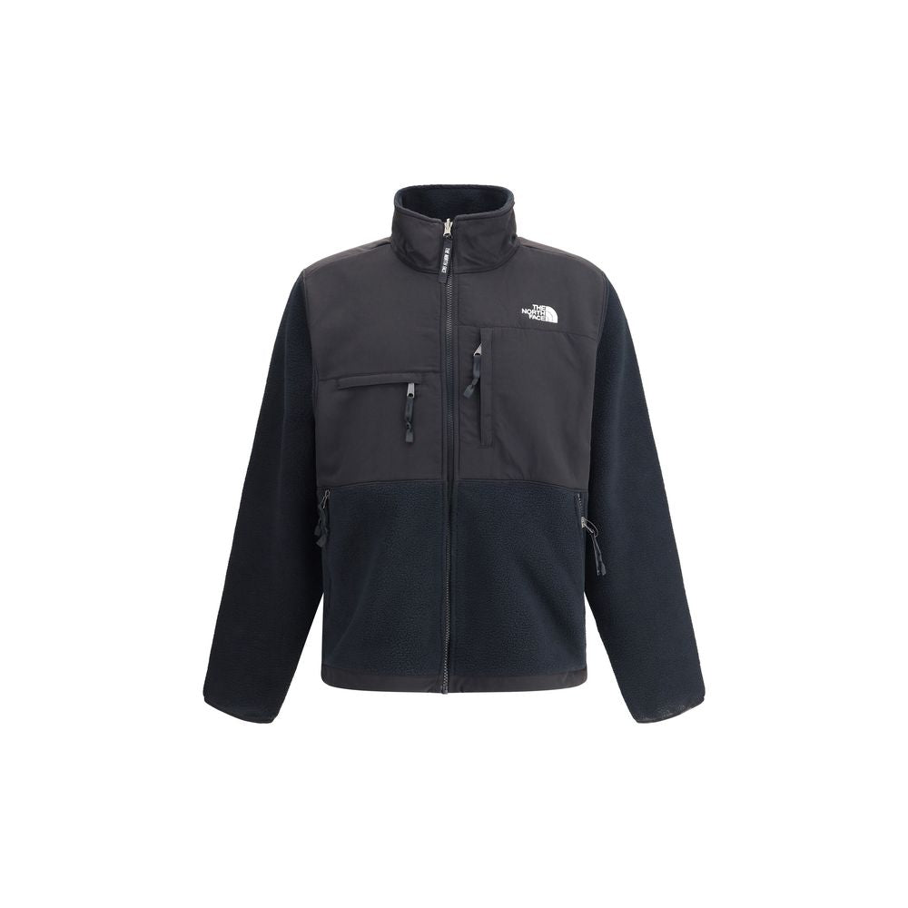The North Face Black Polyamide Shell Jacket with high collar, zipper closure, four front welt pockets, and adjustable hem ties.