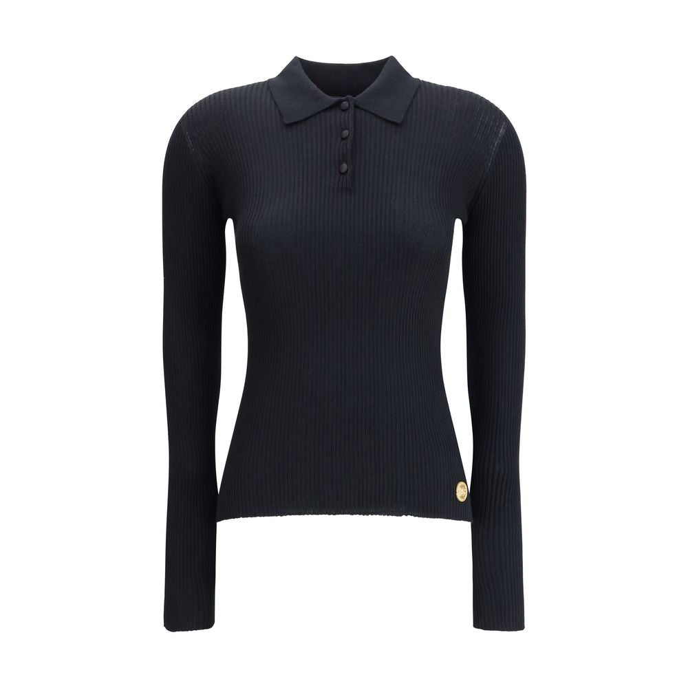 Dolce & Gabbana Black Cashmere Polo Shirt with ribbed design, classic collar, and three-button closure, perfect for elegant outfits.
