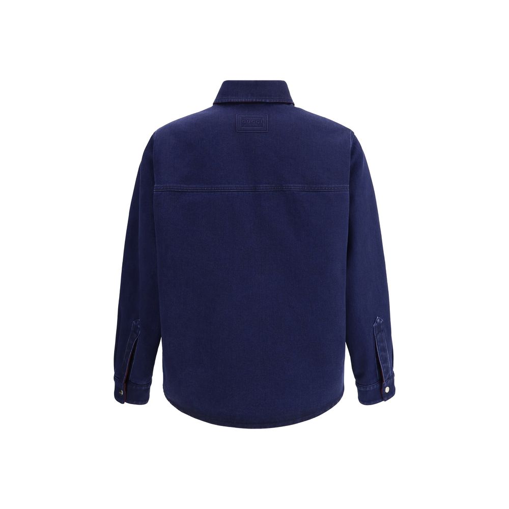 Back view of Gucci Blue Denim Shirt with pointed collar and buttoned sleeves, featuring embossed Gucci label for AW25 season.