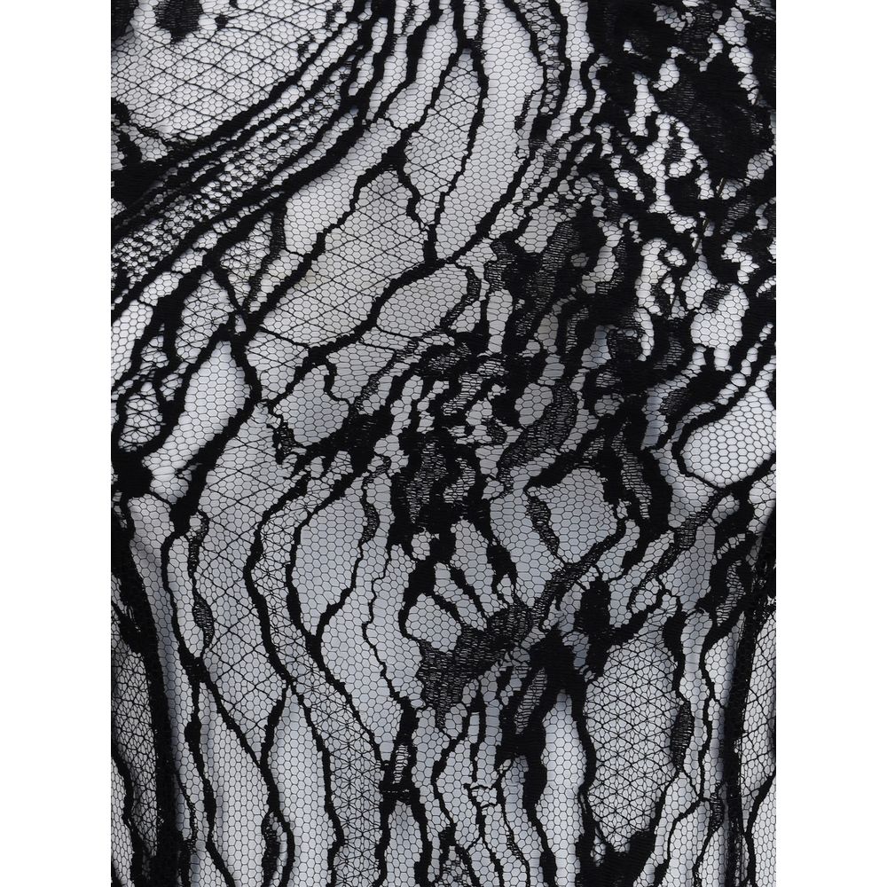 Close-up of sheer lace fabric on Balmain Black Cotton Top with intricate patterns, highlighting elegant and sophisticated design details.
