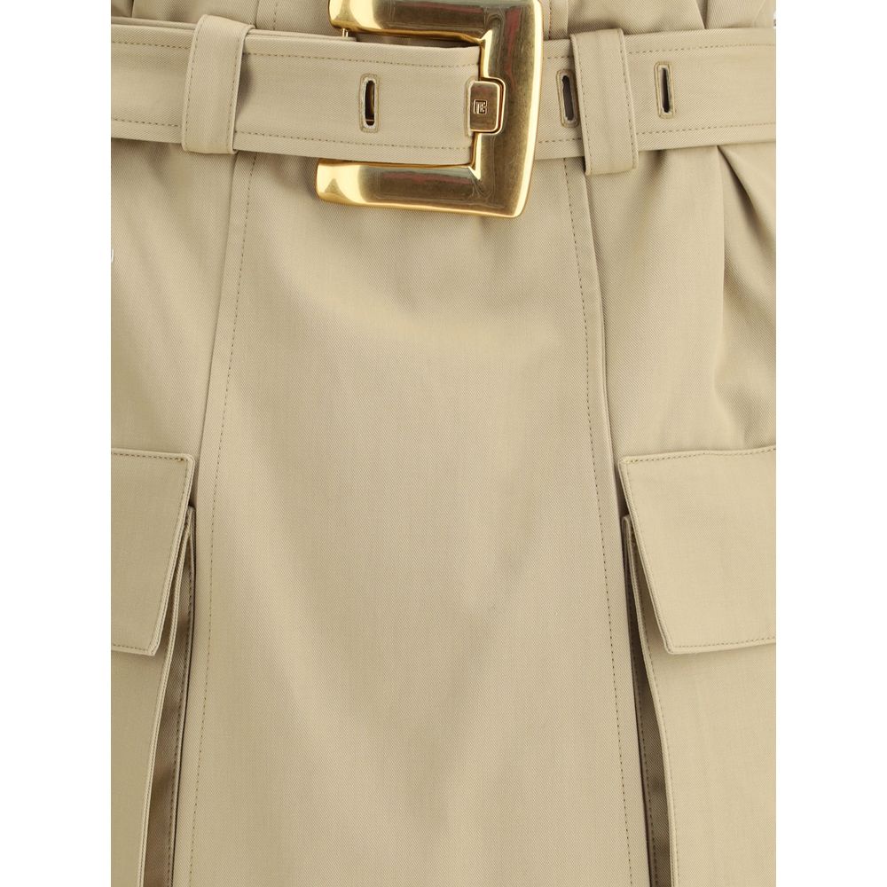 Detail of Balmain Beige Cotton Mini Skirt featuring gold metal buckle and pockets, showcasing iconic utility style.