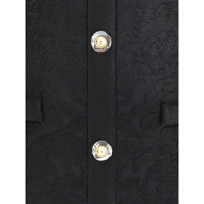 Close-up of Balmain Black Viscose Cocktail Dress showing gold embossed buttons and baroque pattern.