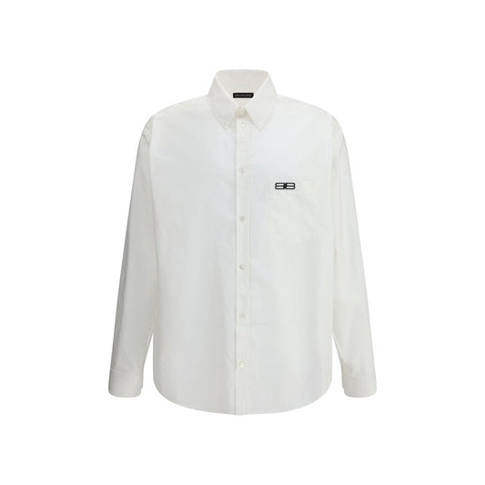 Balenciaga White Cotton Dress Shirt with classic collar and asymmetrical hem, featuring an embroidered logo and front button closure.