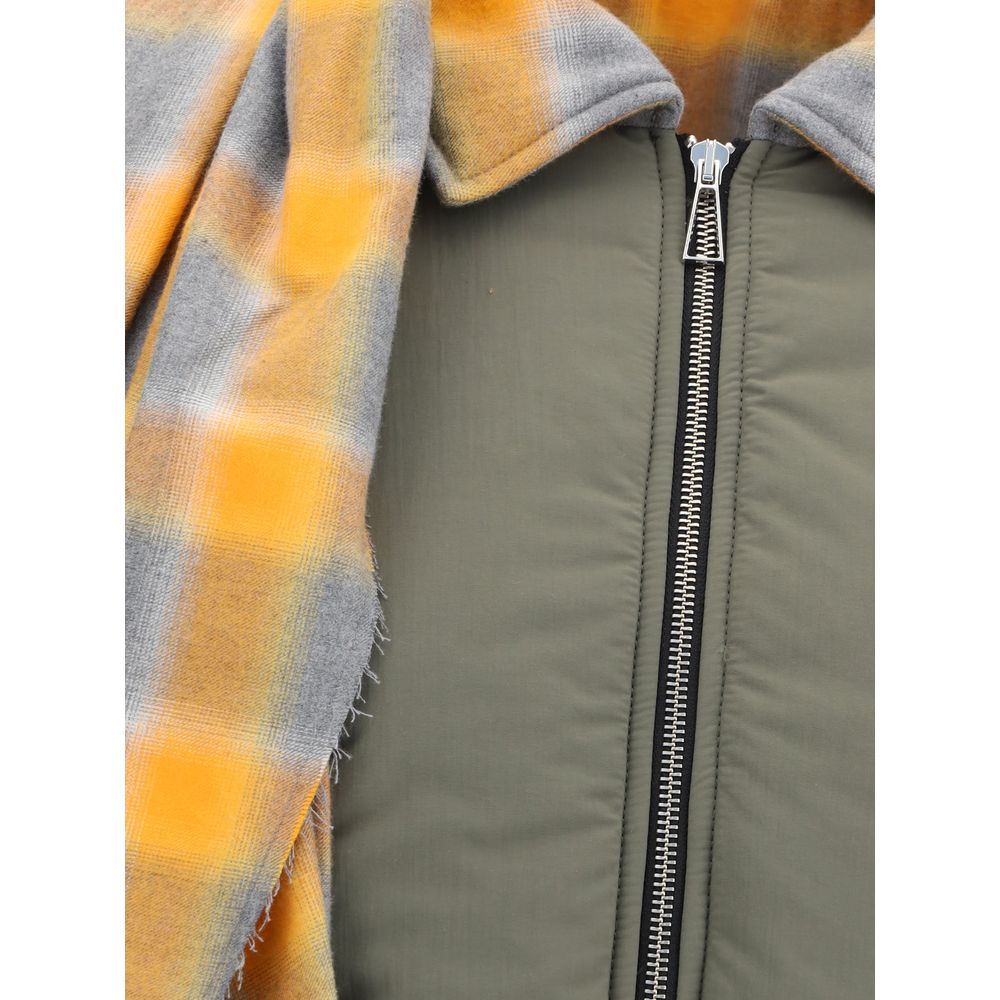Close-up of MARBELL Green Cotton Coat with plaid scarf, zip closure, and quilted design, featuring a stylish and cozy winter look for AW25.