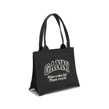 Ganni Black Cotton Shoulder Bag with GANNI logo and sustainability message, featuring top handles and made from recycled cotton.