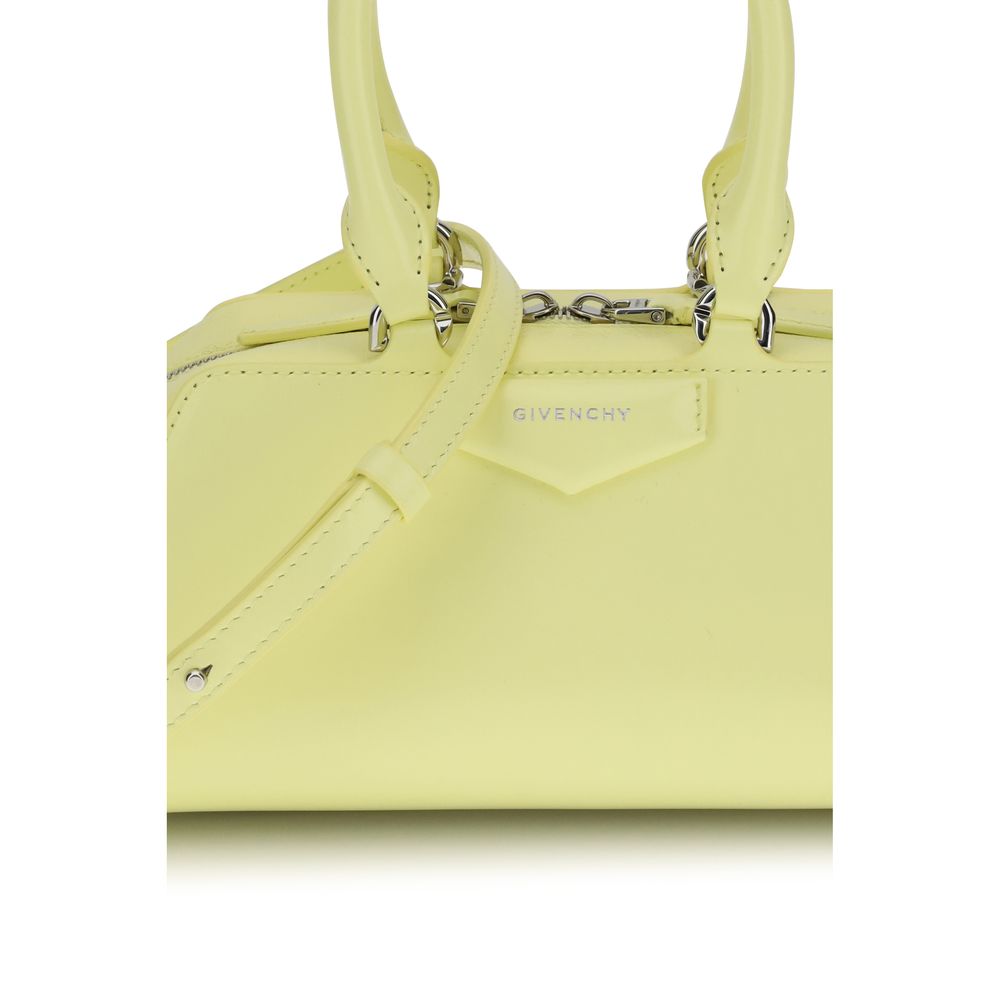 Givenchy Yellow Calf Leather Bos Taurus Handbag with embossed logo, articulated handles, and adjustable strap for versatile style.