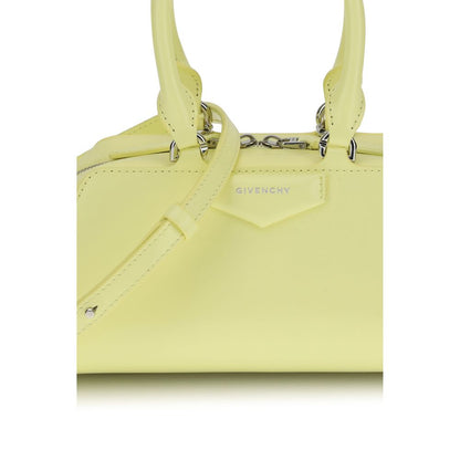 Givenchy Yellow Calf Leather Bos Taurus Handbag with embossed logo, articulated handles, and adjustable strap for versatile style.