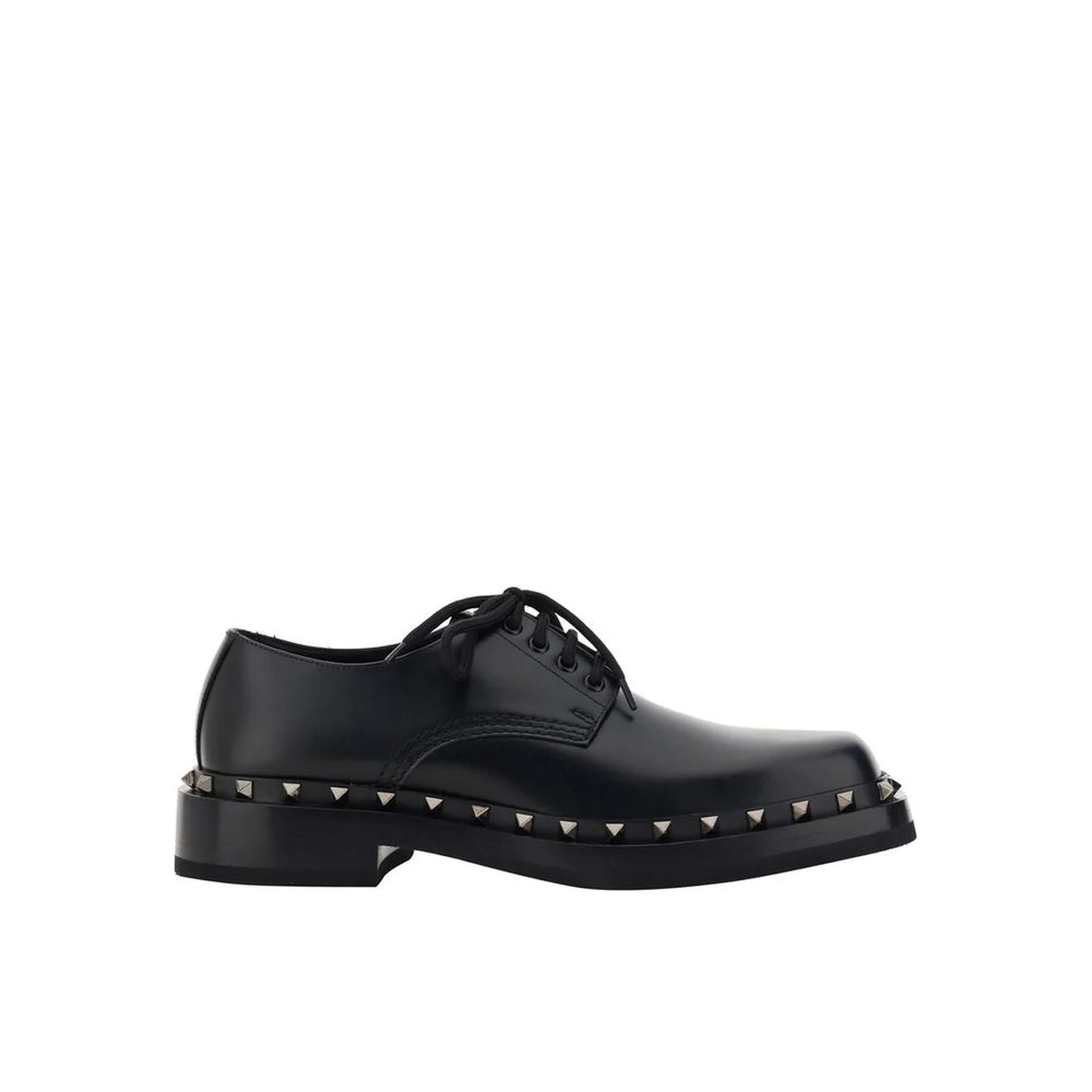 Valentino Garavani Black Calfskin Oxfords And Derbies with studs, leather sole and lace-up closure for men, made in Italy.