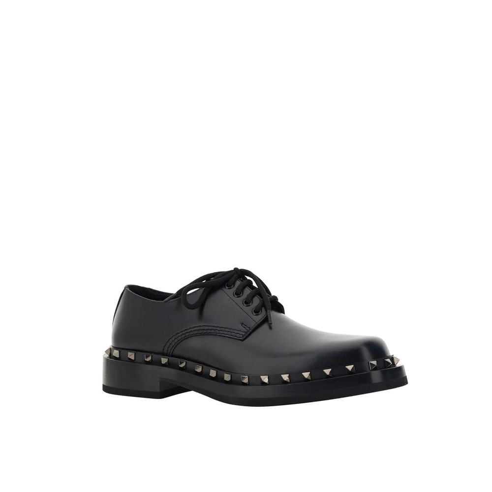 Valentino Garavani Black Calfskin Oxfords And Derbies with studs and lace-up closure, made from 100% leather, for men.