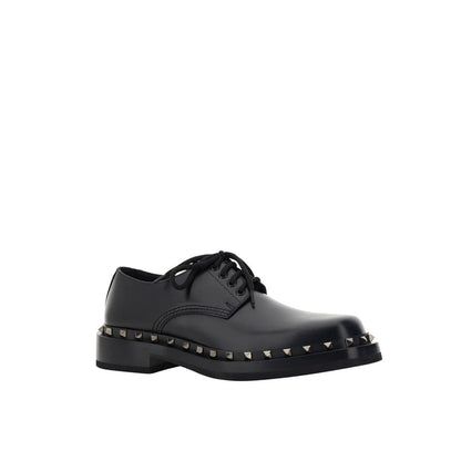 Valentino Garavani Black Calfskin Oxfords And Derbies with studs and lace-up closure, made from 100% leather, for men.
