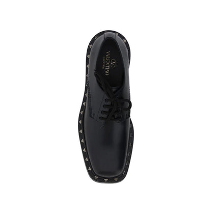 Valentino Garavani Black Calfskin Oxfords And Derbies top view with lace-up closure and studs detail, made in Italy, leather composition.