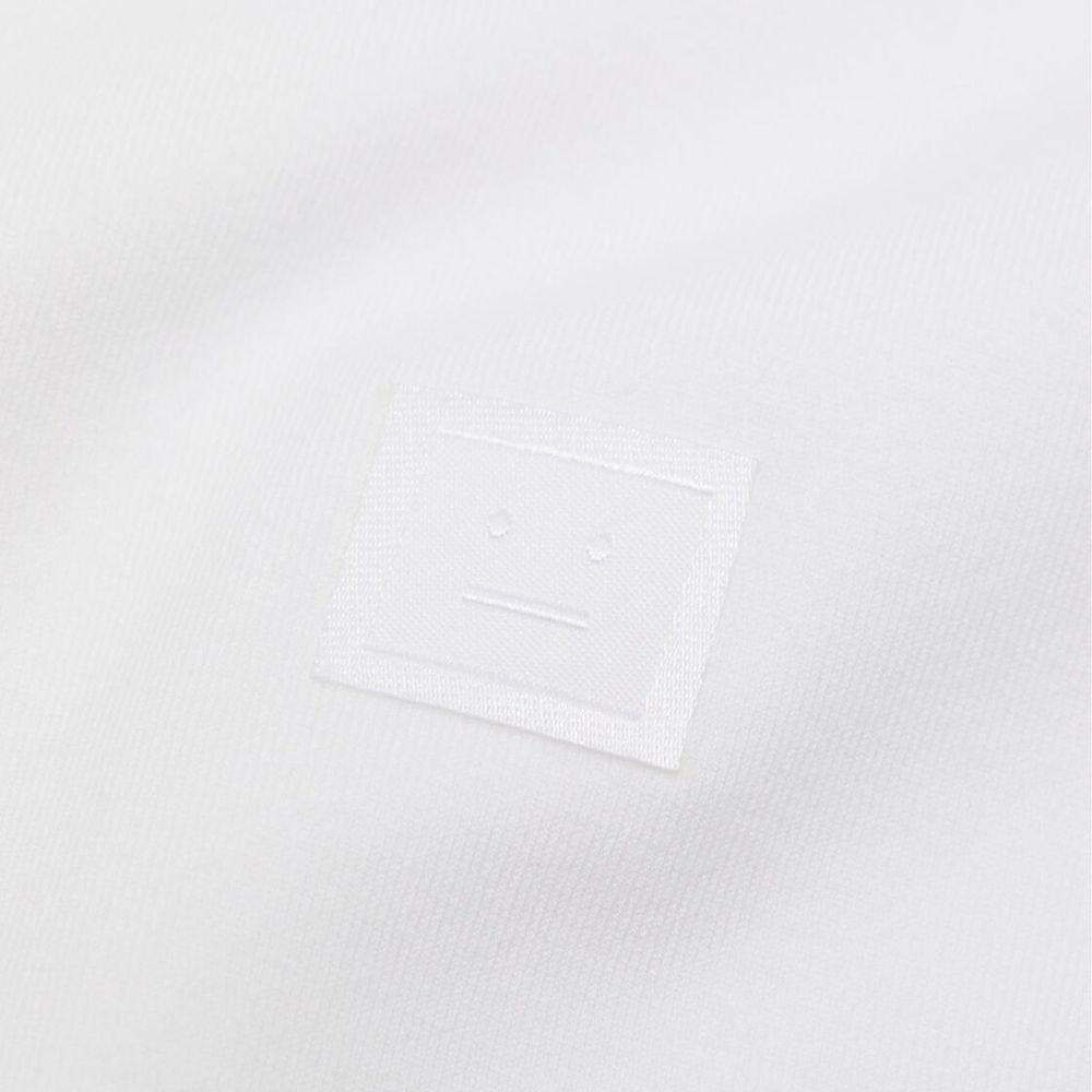 Acne Studios White Cotton T-Shirt with face logo, unisex fit, short sleeves, made in Portugal, model height 188 cm wearing size M.