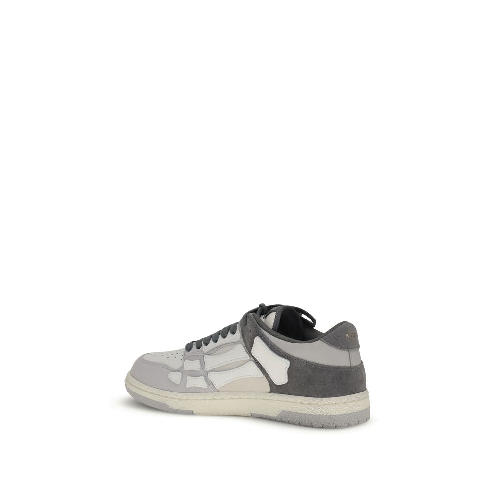 Side view of Amiri Gray Calf Leather Bos Taurus Low Top Sneakers with bone-shaped appliqués and grained leather.