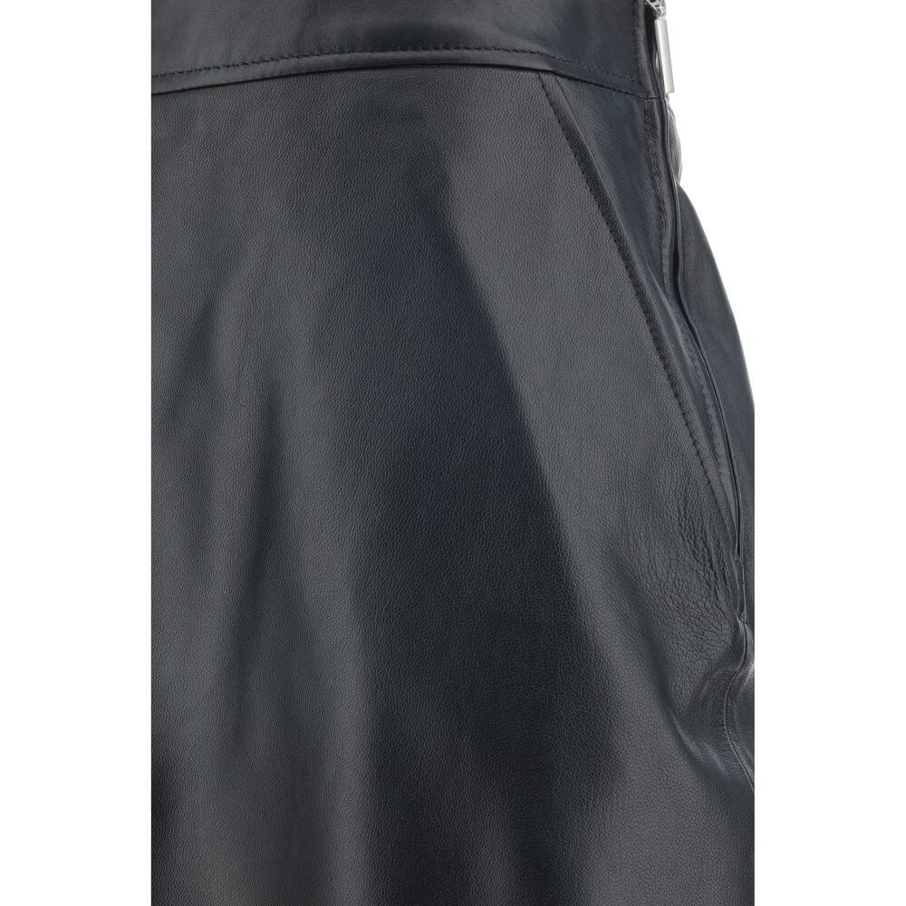 Close-up of Arma Black Lamb Ovis Aries Aries Long Skirt with paneled design and side welt pocket detail in lambskin.