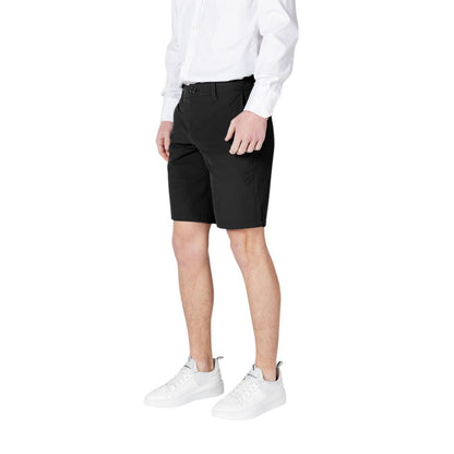 Armani Exchange Black Polyamide Bermuda Shorts on a model wearing a white shirt and white sneakers.