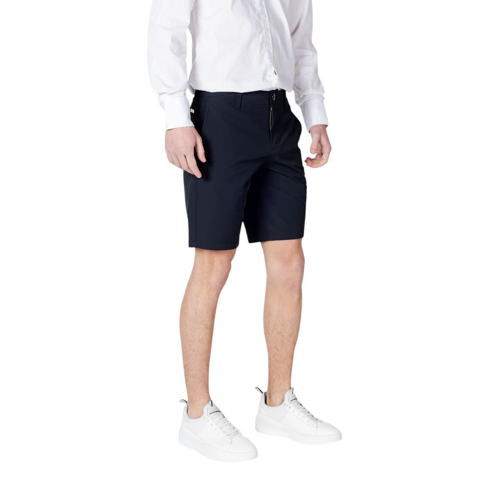 Man wearing Armani Exchange Blue Polyamide Bermuda Shorts with white sneakers
