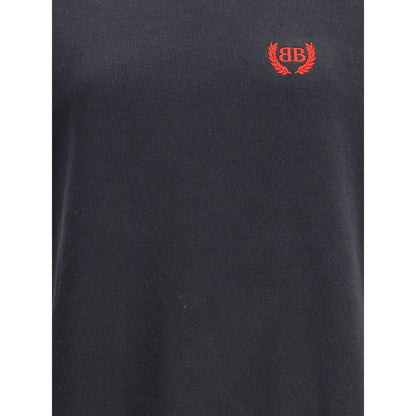 Balenciaga Black Cotton Casual Dress with embroidered logo, ribbed neck, cuffs, and pleated skirt for a stylish oversized silhouette.